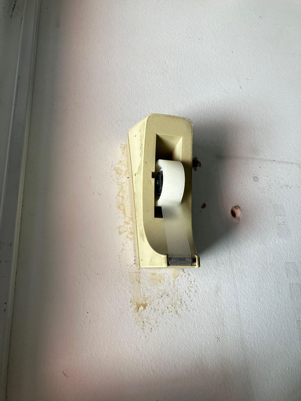 Someone stole the tape dispenser from my desk at work and glued it to the wall in our electrical panel room I dont know why