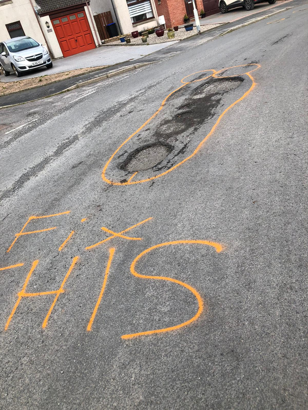 Someone Trying to get the council to fix the potholes in an ingenious way
