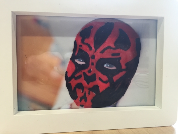 Sometimes my colleagues draw on my daughters photo with whiteboard markers