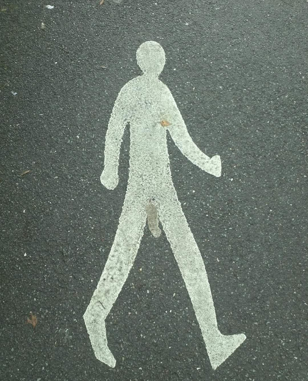 somone in my town has made this guy feel a little more adequite than the other pedestrian walk way signs 