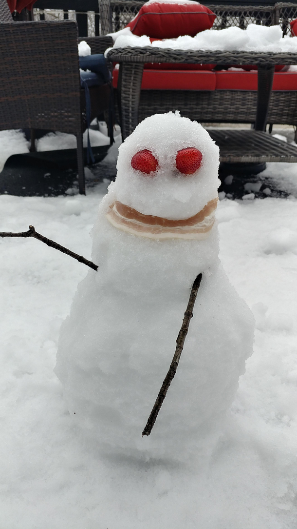 Son made a snowmanused bacon for the smile