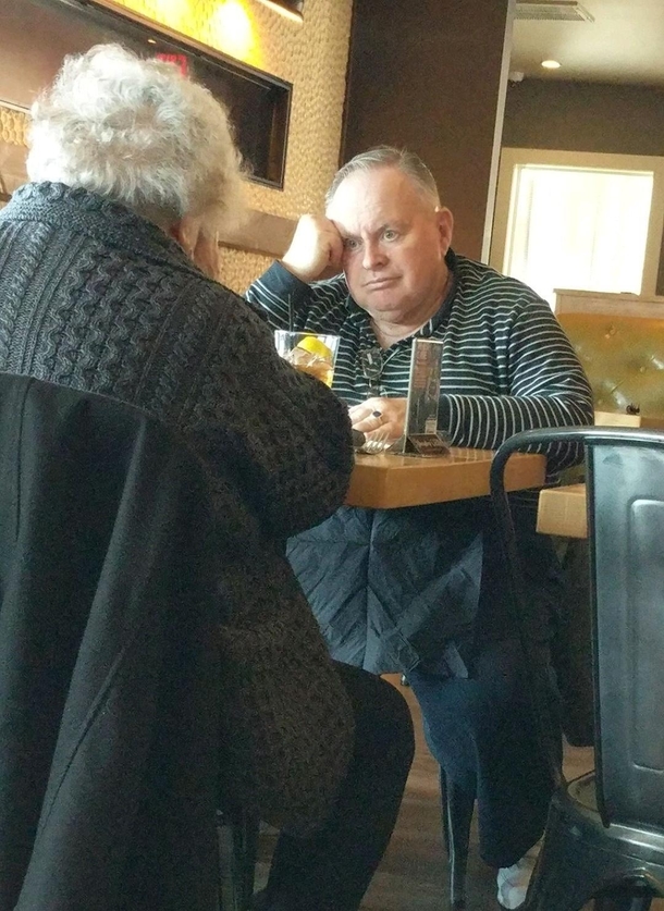 Spotted this couple while having lunch Shes talking but I guarantee he aint listening