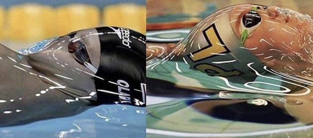 Swimmers face just before the waters surface tension is broken