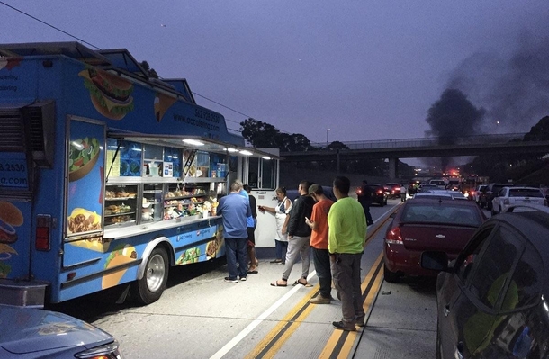 Taco truck start doing business during accident related traffic jam