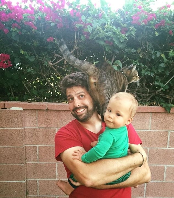 Taking a picture with my friends baby when suddenly out of nowhere