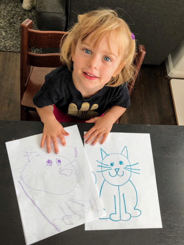Taught my yo how to draw a cat I think she did pretty well