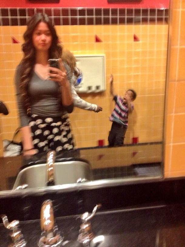 That awkward moment when youre trying to take a selfie and a mother decides to beat her child with her sandal