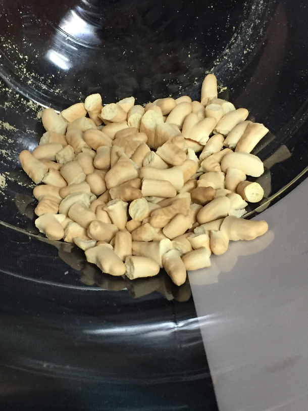 The bottom of a huge container of animal crackers is just a mass grave of animal parts