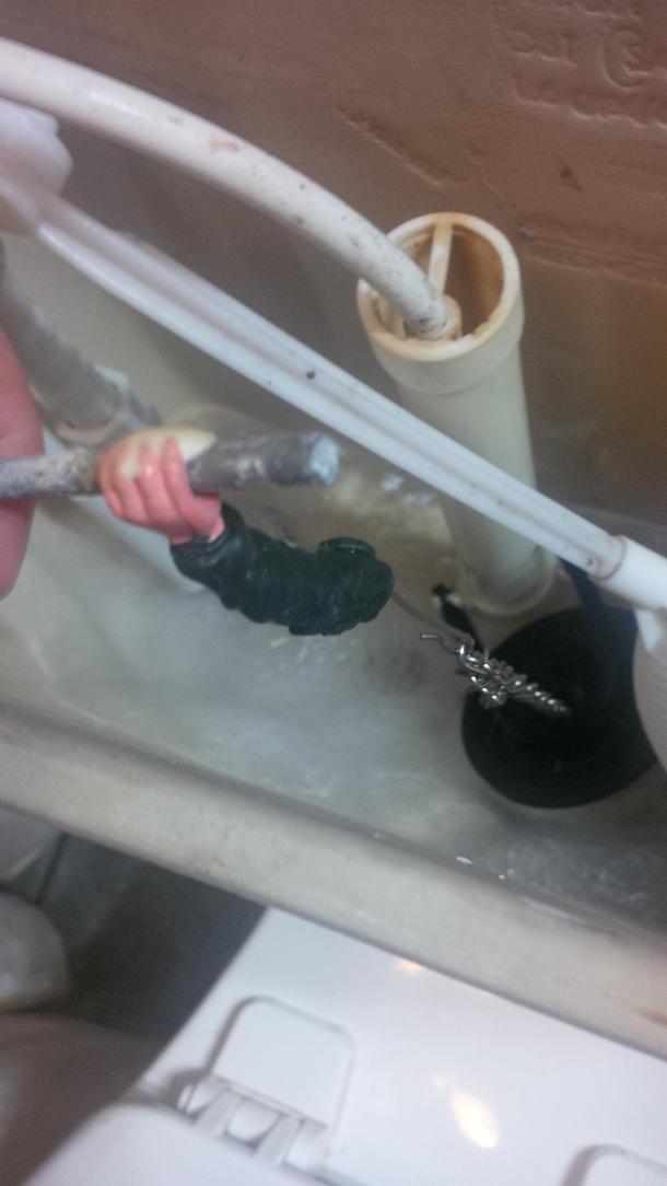 The chain in the back of the toilet broke so my dad summoned up his old fashioned Macgyver skills to fix it