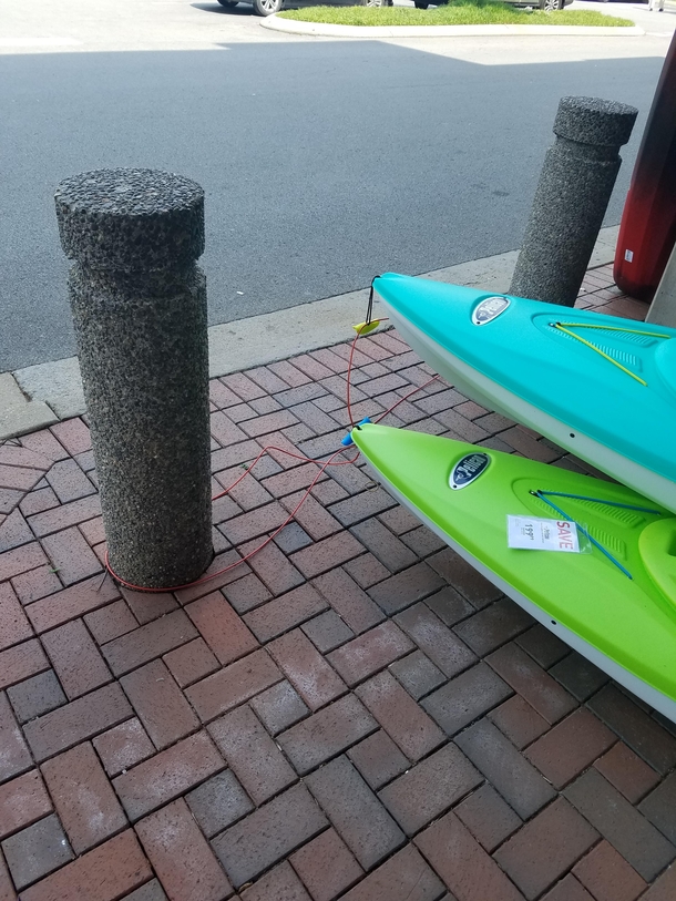 The complex security for kayaks outside of Dicks Sporting Goods