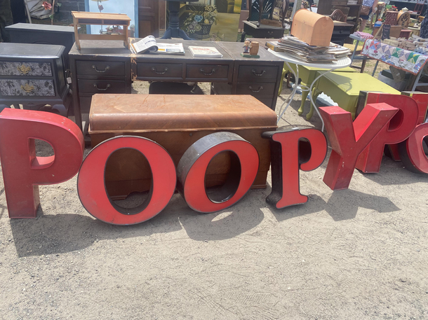 The first thing I noticed at the Brimfield antique show today was this sign Keep on being weird Brimfield