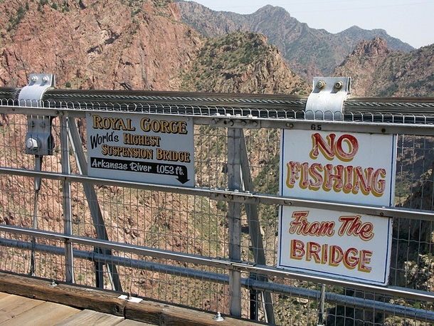 The highest suspension bridge in the world Royal Gorge Bridge in Canon City Colorado which is  feet above the water has this sign warning off would-be anglers