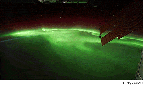 The International Space Station flying over the Northern Lights