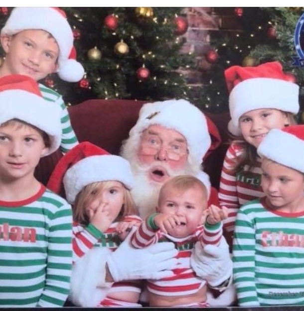 The look on this Santas face after  minutes of dealing with my two sons and their cousins