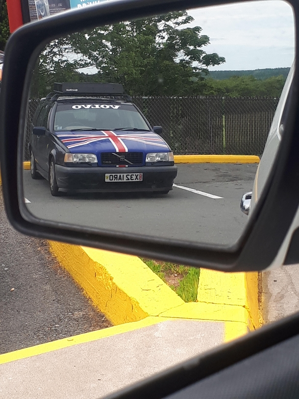 The reflection of this guys license plate