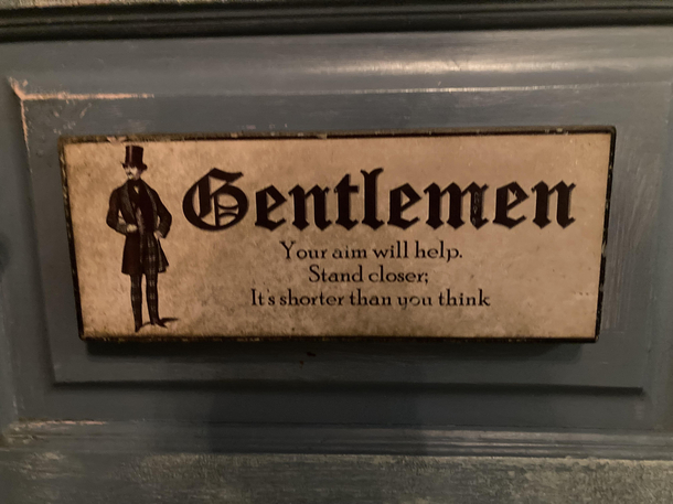 The sign at the mans bathroom srry for bad lighting