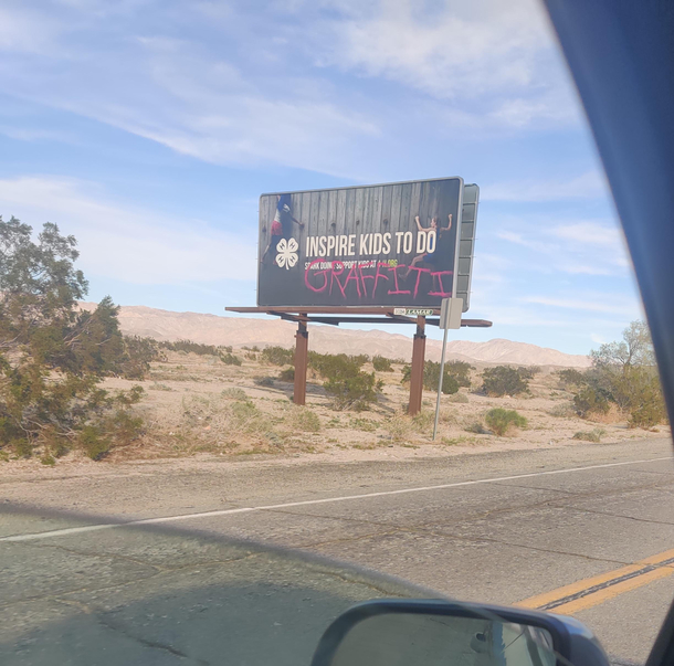 The tagging on this inspirational billboard