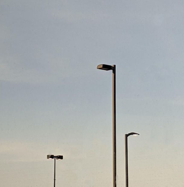 There seems to have been some disagreement on what style of light to use in this shopping center carpark