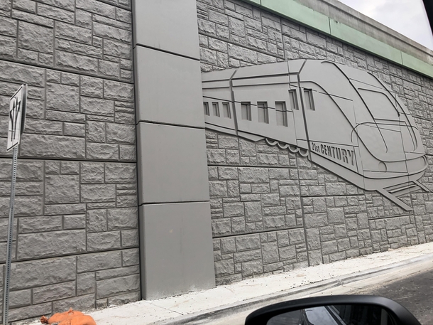 They built a picture of a train on the side of a Texas highway presumably so Texans can think about all the public transportation they cant use while they are stuck in traffic