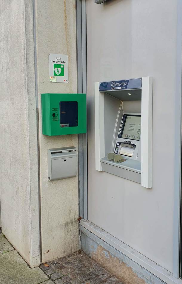 This ATM in Denmark with a defibrillator hanging right next to it just in case you get a heart attack when seeing your account balance