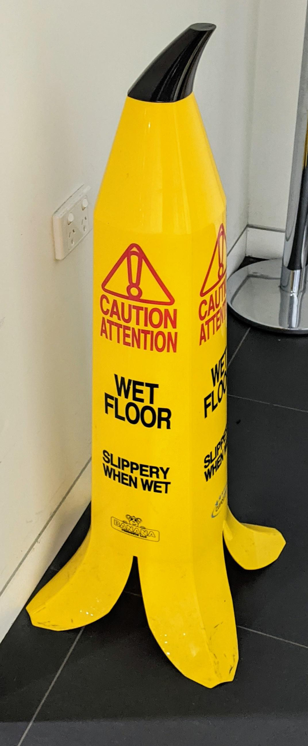 This banana shaped slip hazard sign for wet floors QLD Australia