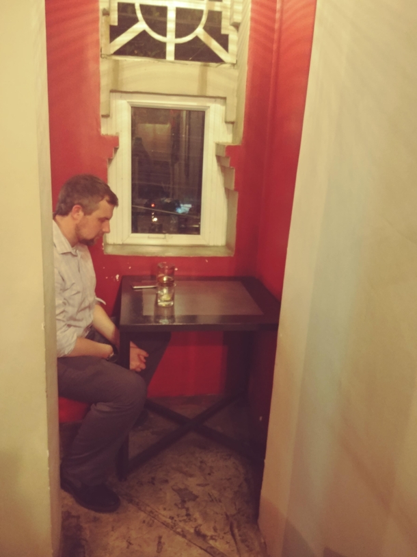 This bar had a table for introverts one small table and chair in a closet closed off from everyone else