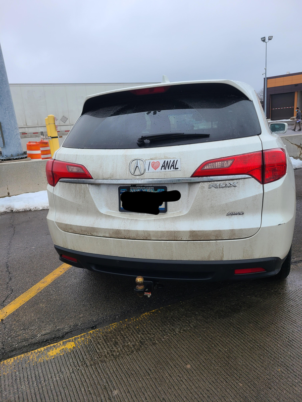 This bumper sticker on a car at work