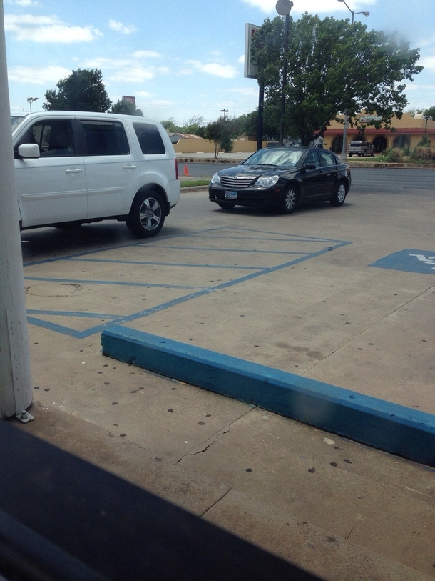 This car has been sitting there for  minutes thinking its the drive thru The car in front is parked in a parking spot