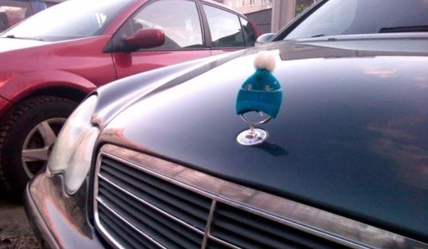 This cars owner put a hat on its hood ornament because its getting colder outside