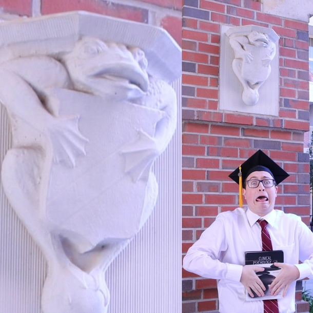 This frog statue always made me laugh So I imitated it for my grad pics