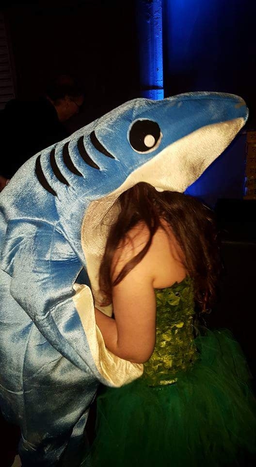 This guy was dressed as Katy Perrys shark in a party an this is him kissing a girl