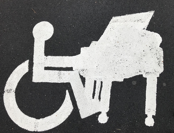 This handicap parking sign at the piano store