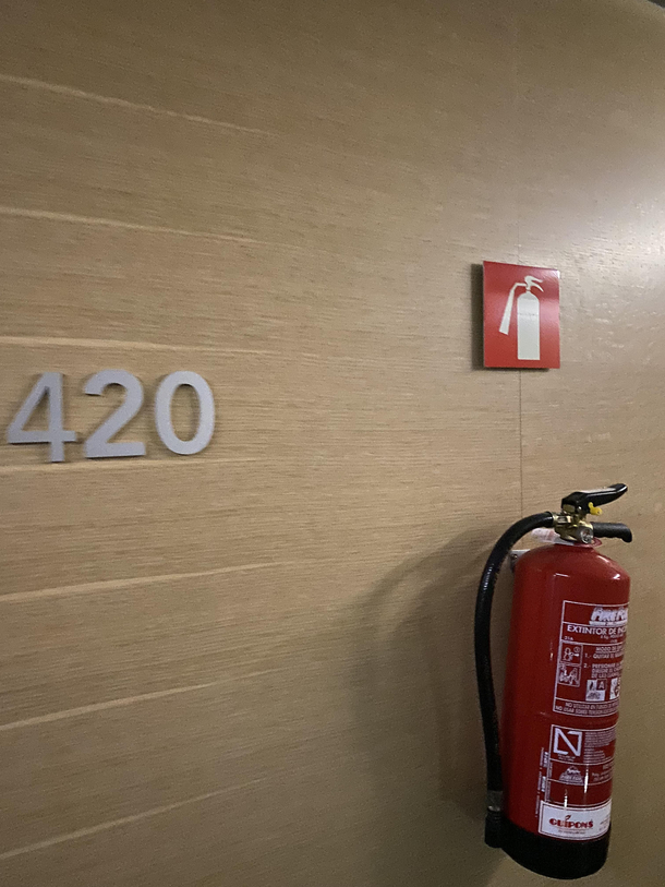 This hotel room added a fire extinguisher next to this popular room since many people were lighting it up Sorry for the low quality long day