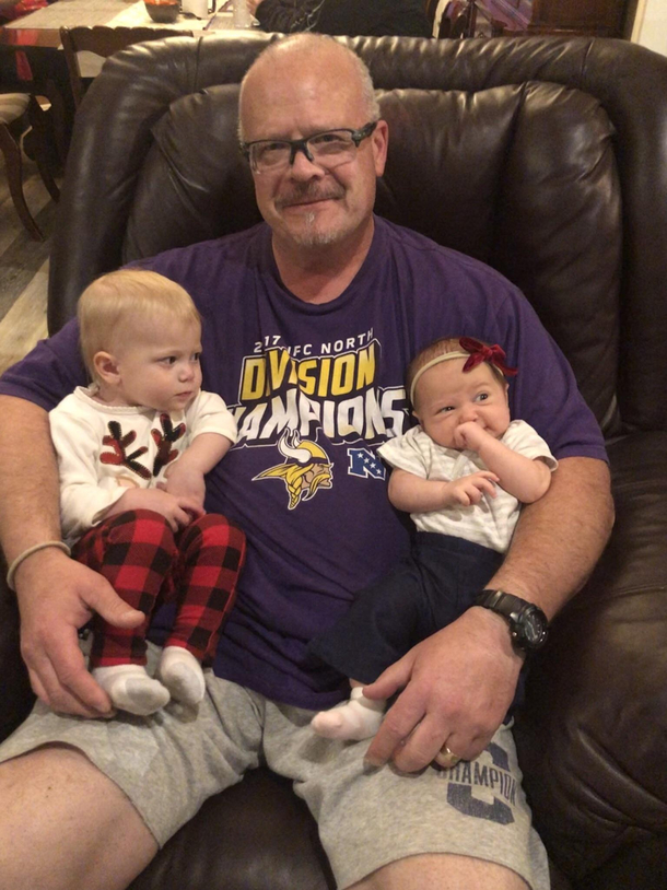 This is my daughters first Christmas Her cousin wasnt taking too kindly to having to share grandpa