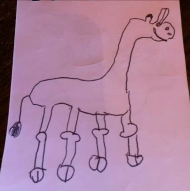 This little girl drew the nice giraffe she saw at the zoo