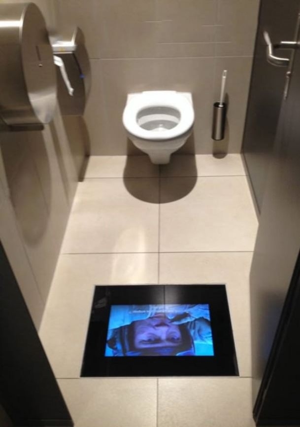 This movie theater has screens in the bathrooms so you dont miss any of the actionThis movie theater has screens in the bathrooms so you dont miss any of the action