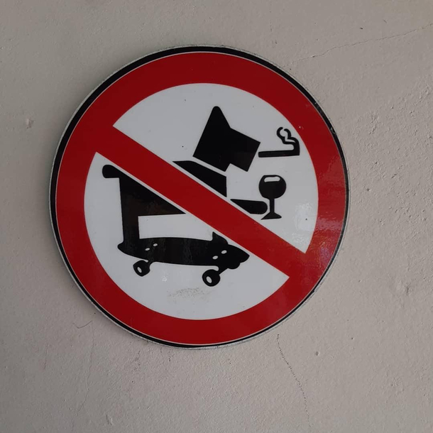 This place combined their prohibited signs to make it look like that dog is having a great time