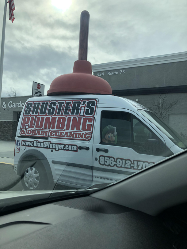 This Plumbers truck with a huge plunger on the roof and Luigi riding shotty