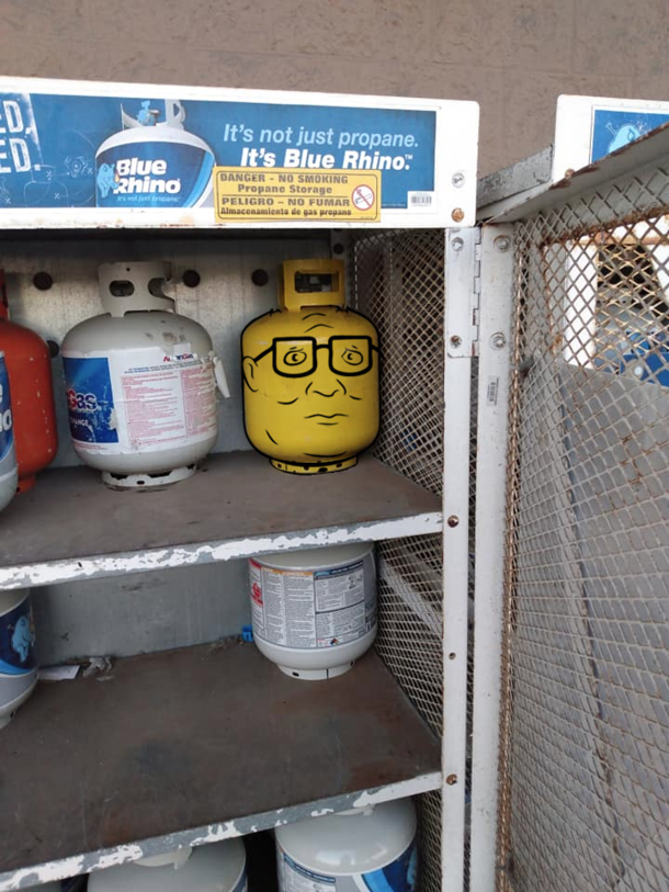 This propane tank painted like Hank Hills Lego head