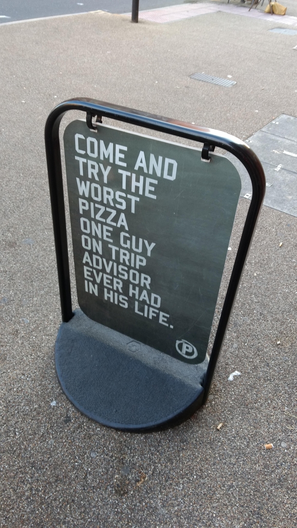 This sign at a pizza restaurant