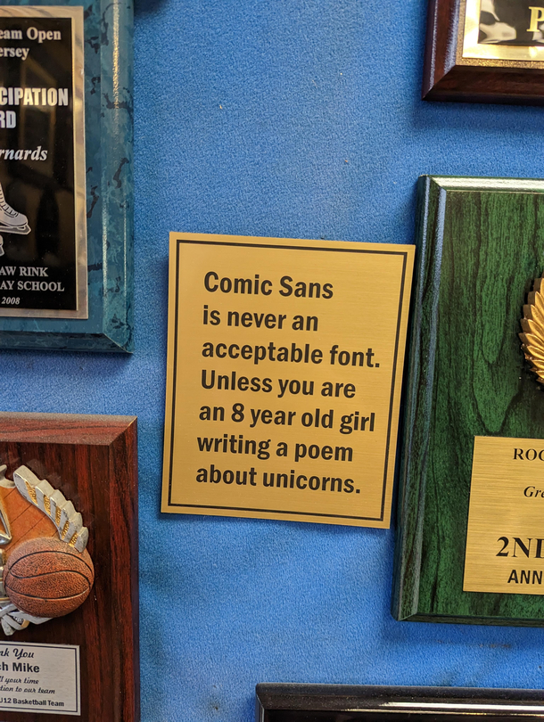 This sign at the trophy shop in town