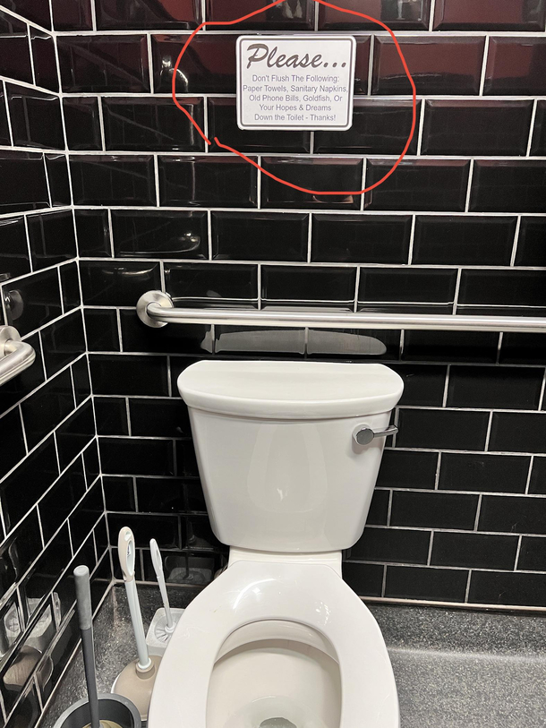 This sign in the bathroom at my barbershop