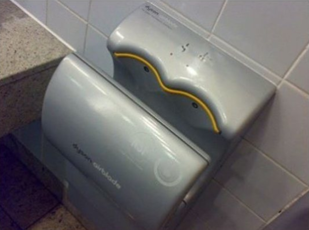 This urinal is a fucking joke Piss literally everywhere