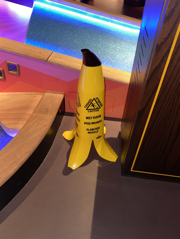 This wet floor sign at a mini golf course