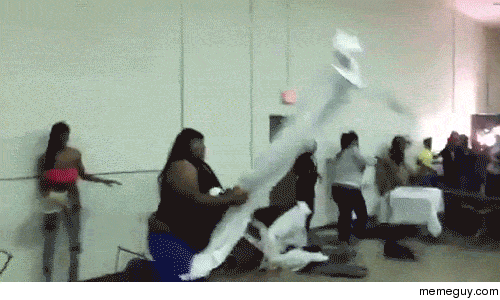 This woman hulks out throwing a table and catching a folding chair in mid-air No idea whats going on