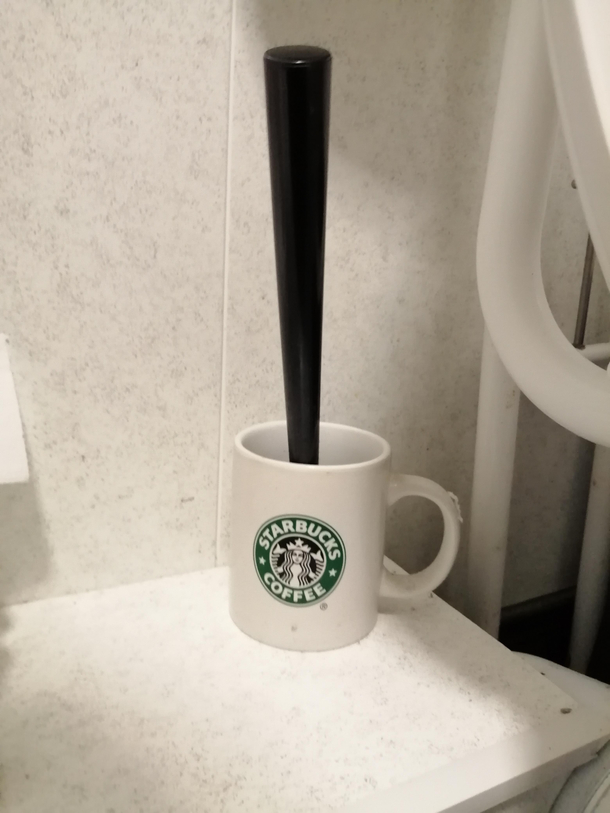 Toilet brush holder in an independent coffee shop