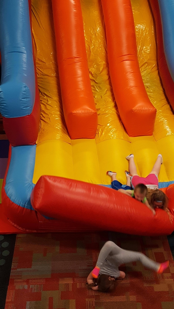 Took my daughter to a local bouncing house for her birthday Shes the one in the pink and orange socks