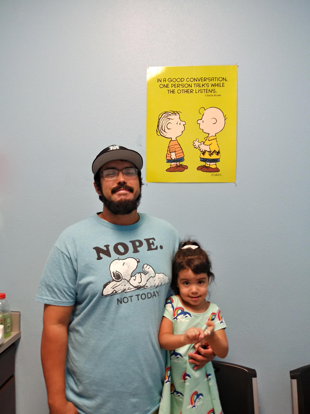 Took this photo of my daughter and her daddy last time we visited her pediatrician The Peanuts mini comic strip was a complete coincidence
