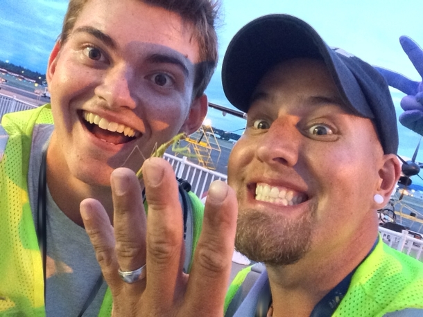 Two guys found a praying mantis and took a picture with it Looks like an engagement photo