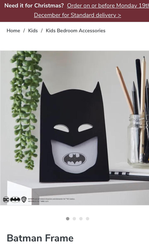 Unfortunately placed bat signal has made Batman look like hes got terrible teeth
